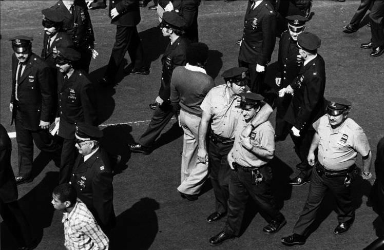#16 The funeral of a police officer killed on duty, 1979.