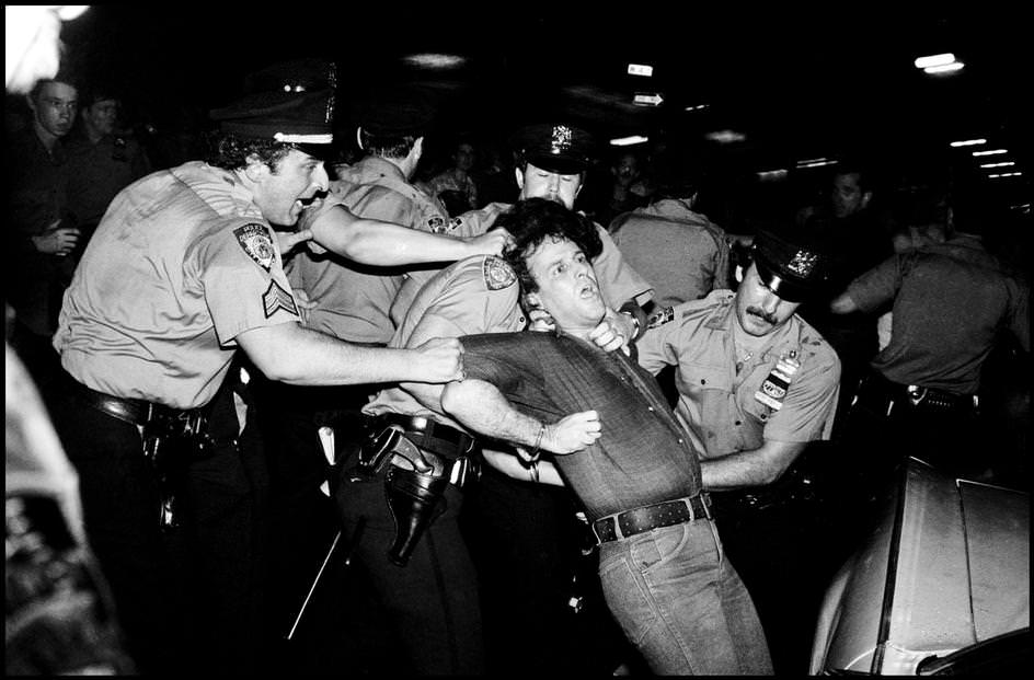 #63 A protester refused to leave the roadway and was taken away by force, 1979.