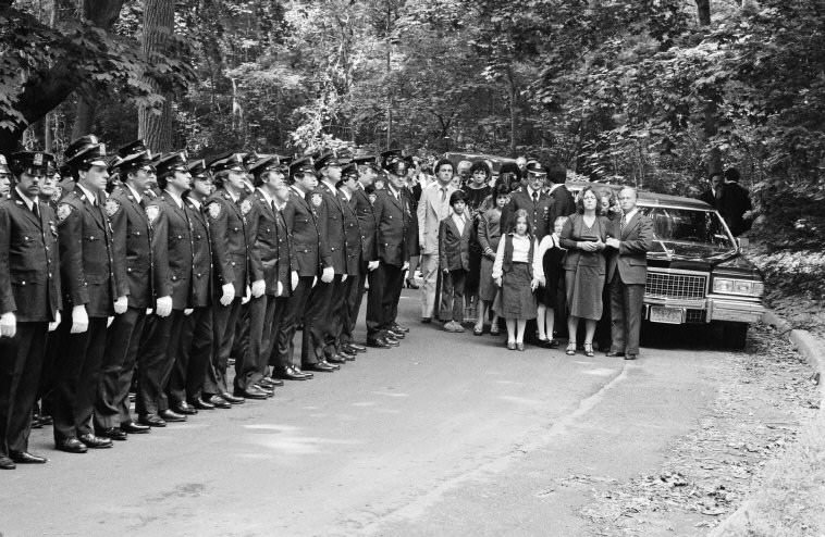 #66 The funeral of a police officer who was killed on duty, 1979.