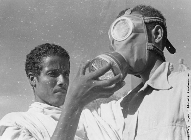 #7 An Abyssinian soldier wearing a gas mask during training in Addis Ababa, 1935.