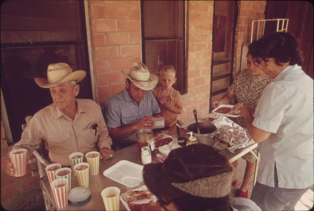 #1 A ranch family eating on their bunkhouse porch near Leakey, Texas, 1973.