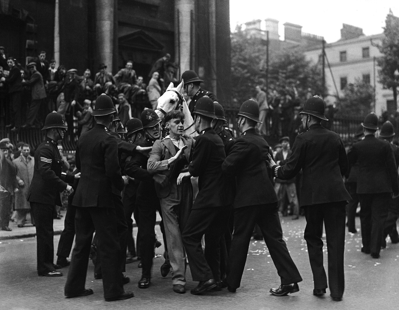 #15 A young demonstrator clashing with police during Sir Oswald Mosley’s fascist march in Trafalgar Square, 1937.