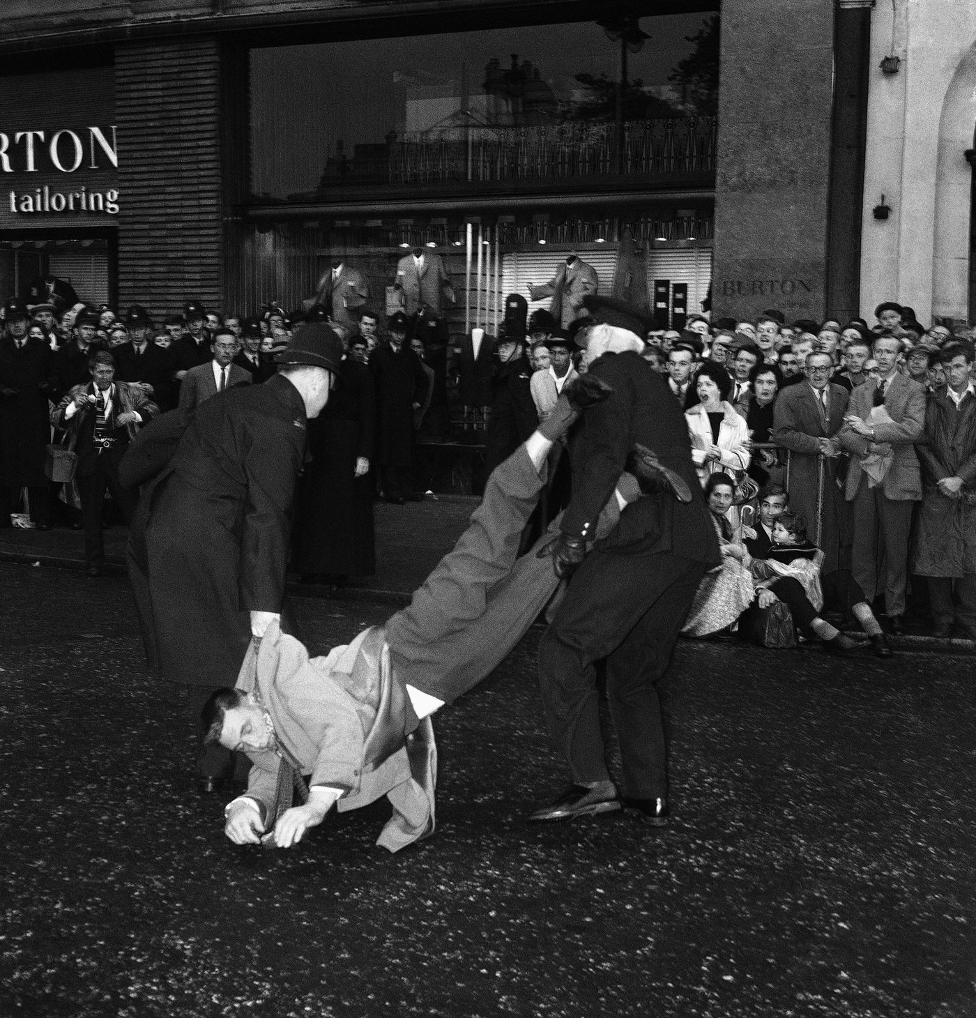 #40 A demonstrator being arrested at a Ban-the-bomb rally in Trafalgar Square, 1961.