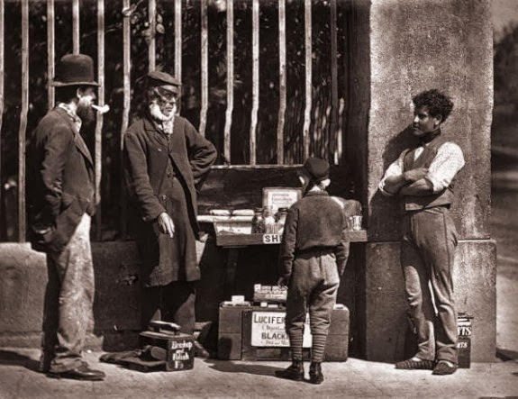 #18 A street trader and shoeshine in Victorian London, 1877.