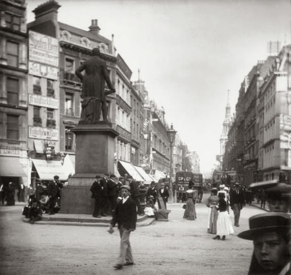 #32 Pedestrians on London’s Cheapside, near the statue of Robert Peel, 1890.
