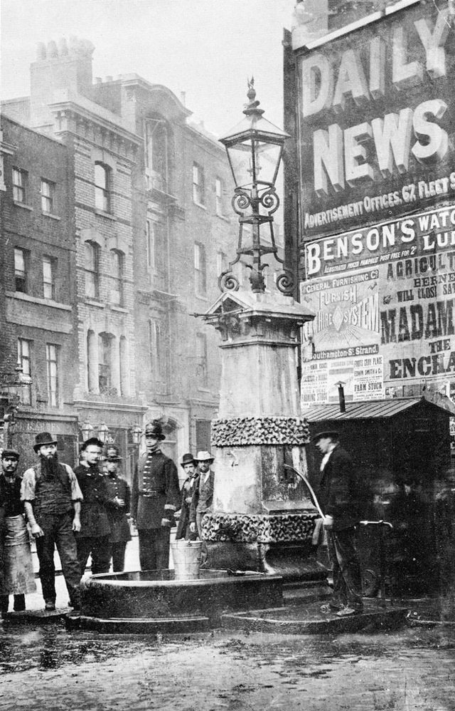 #45 Filling a bucket at Aldgate Pump, East End London.