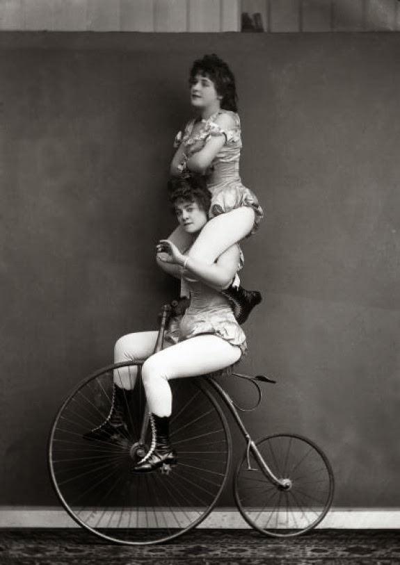 #9 Victorian trick cyclists performing a balancing act, 1891.