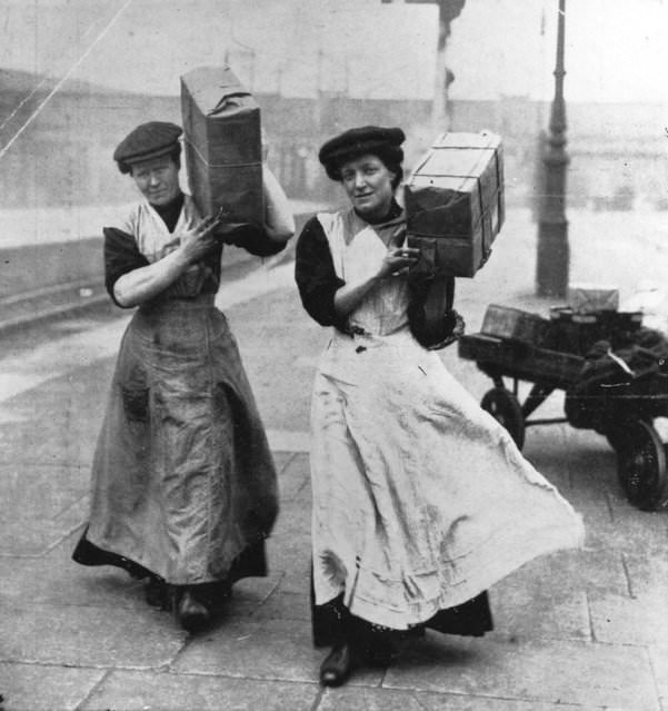#23 Two women replacing male porters at Marylebone Station, London, during World War I, 1915.