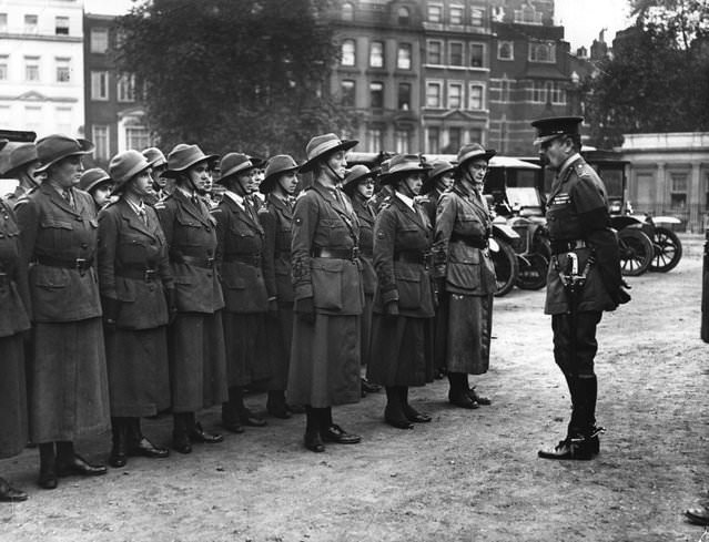 The Women’s Reserve of the British Army National Motor Volunteers being addressed by an officer, 1916.