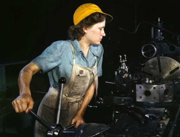 #39 A lathe operator machines parts for transport planes at Consolidated Aircraft Corporation, Fort Worth, Texas, 1942.