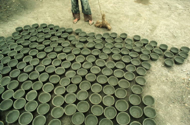 #20 Traditional form of making earthen pottery and drying it in the sun, 1984.