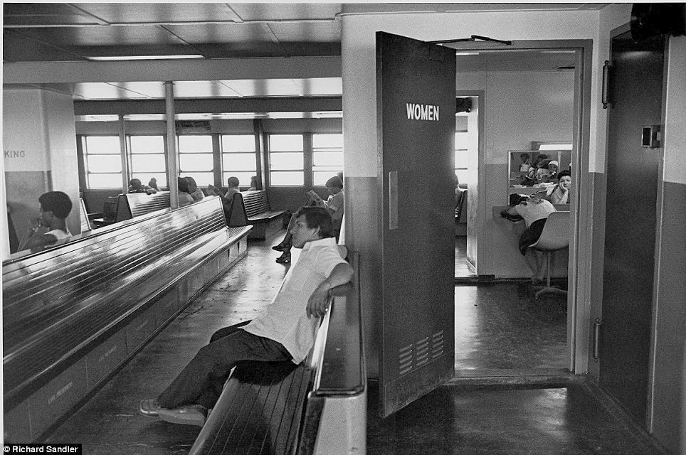 #1 Inside the women’s room on the Staten Island Ferry, a woman slumps in front of the mirror, 1978.