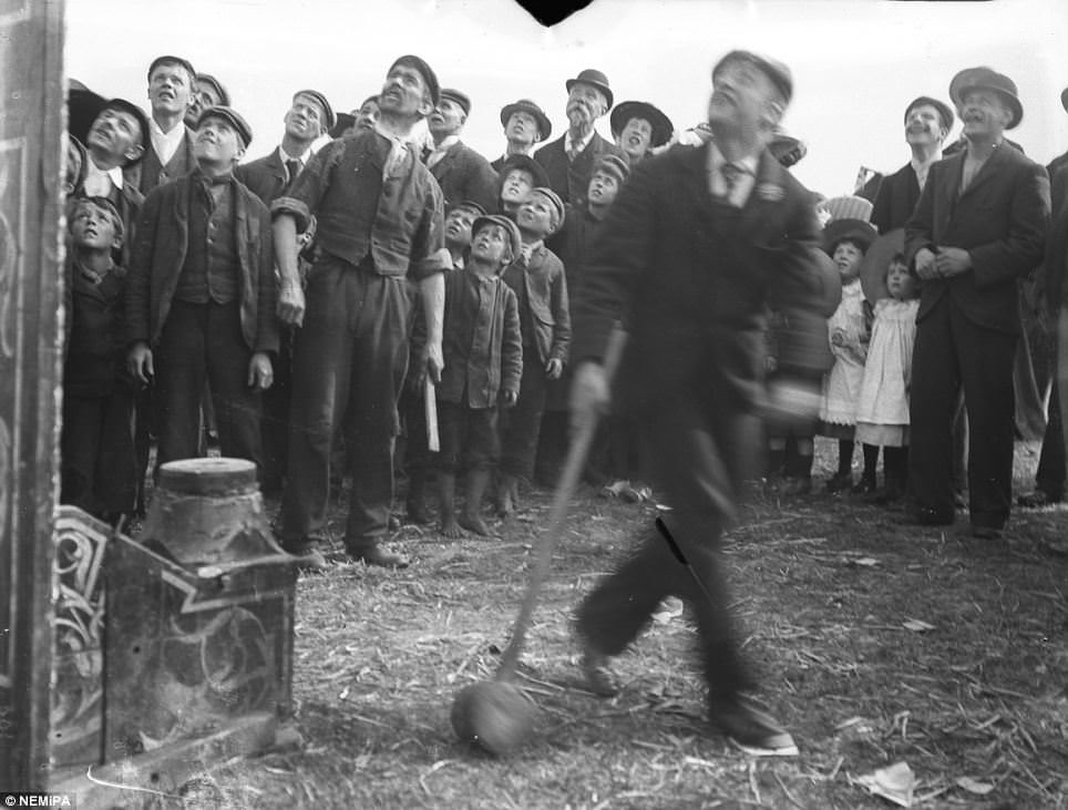 #10 A doughty competitor tests his strength at the Temperance festival on the Town Moor, Newcastle.