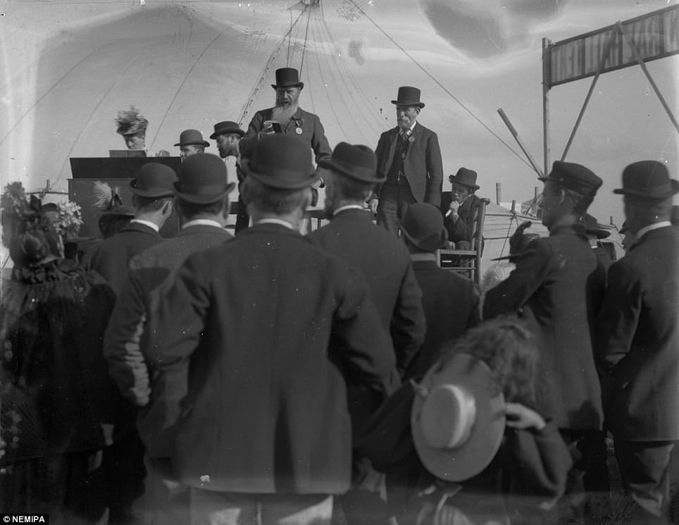 #11 A little girl looses her hat, while men in bowlers listen to a speech at the Temperance Festival on the Town Moor, Newcastle.