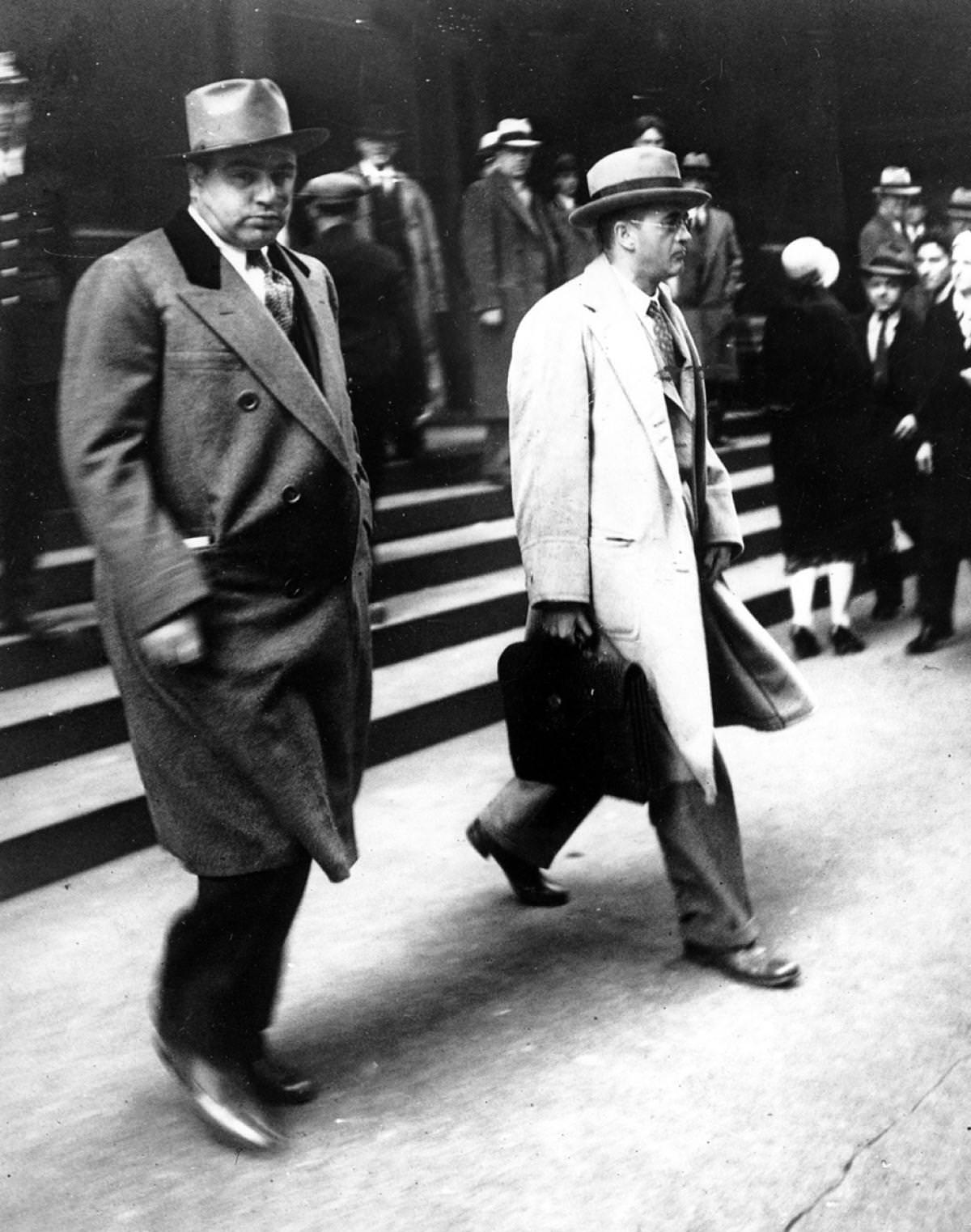 #11 Al Capone leaving Federal Court in Chicago with his attorney Michael Ahern, October 11, 1931.