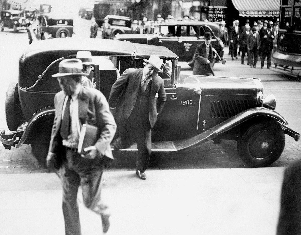 #23 Al Capone leaving a taxi outside the Chicago Federal Courthouse to attend his trial, October 8, 1931.