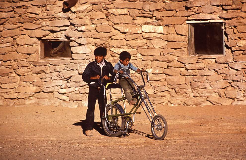 #1 Boys play on a bicycle on the Hopi Reservation in Arizona, 1972.