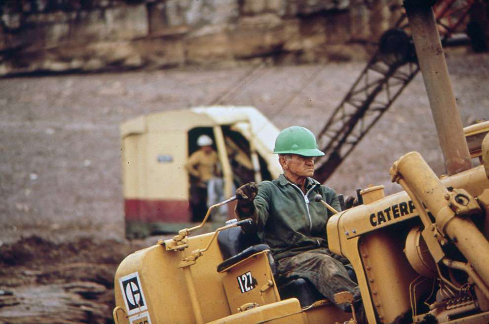 #27 Dragline and workers at the site of an oil spill cleanup on the San Juan River in Monument Valley, Utah, 1972.