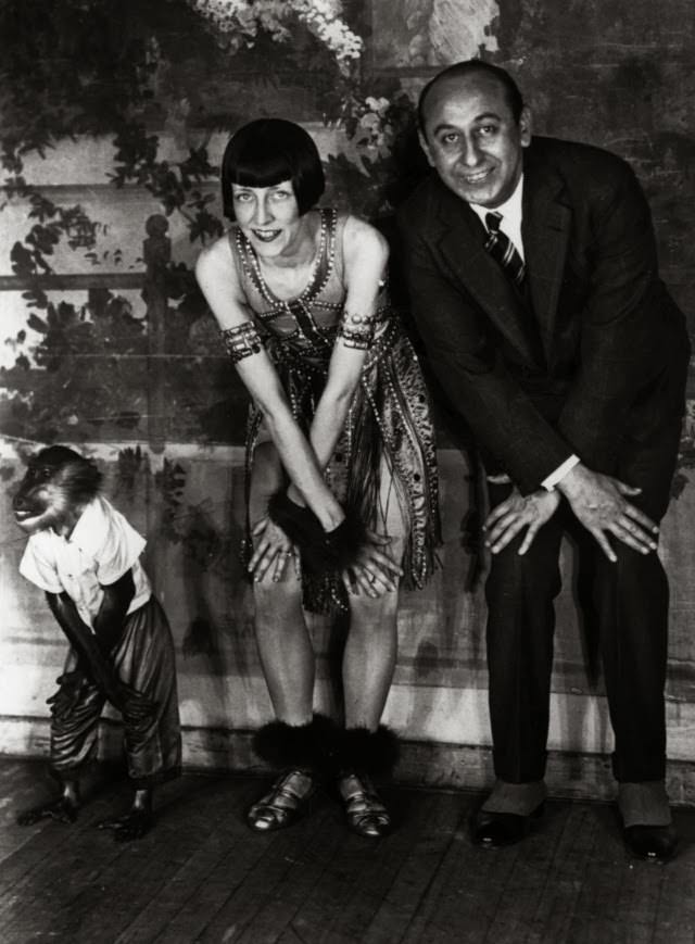 A monkey doing the ‘Charleston’ alongside a couple of dancers, 1922.
