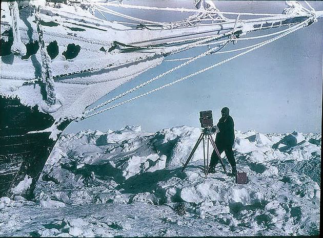 #1 Frank Hurley photographing under the bows of the ‘Endurance’, 1915.