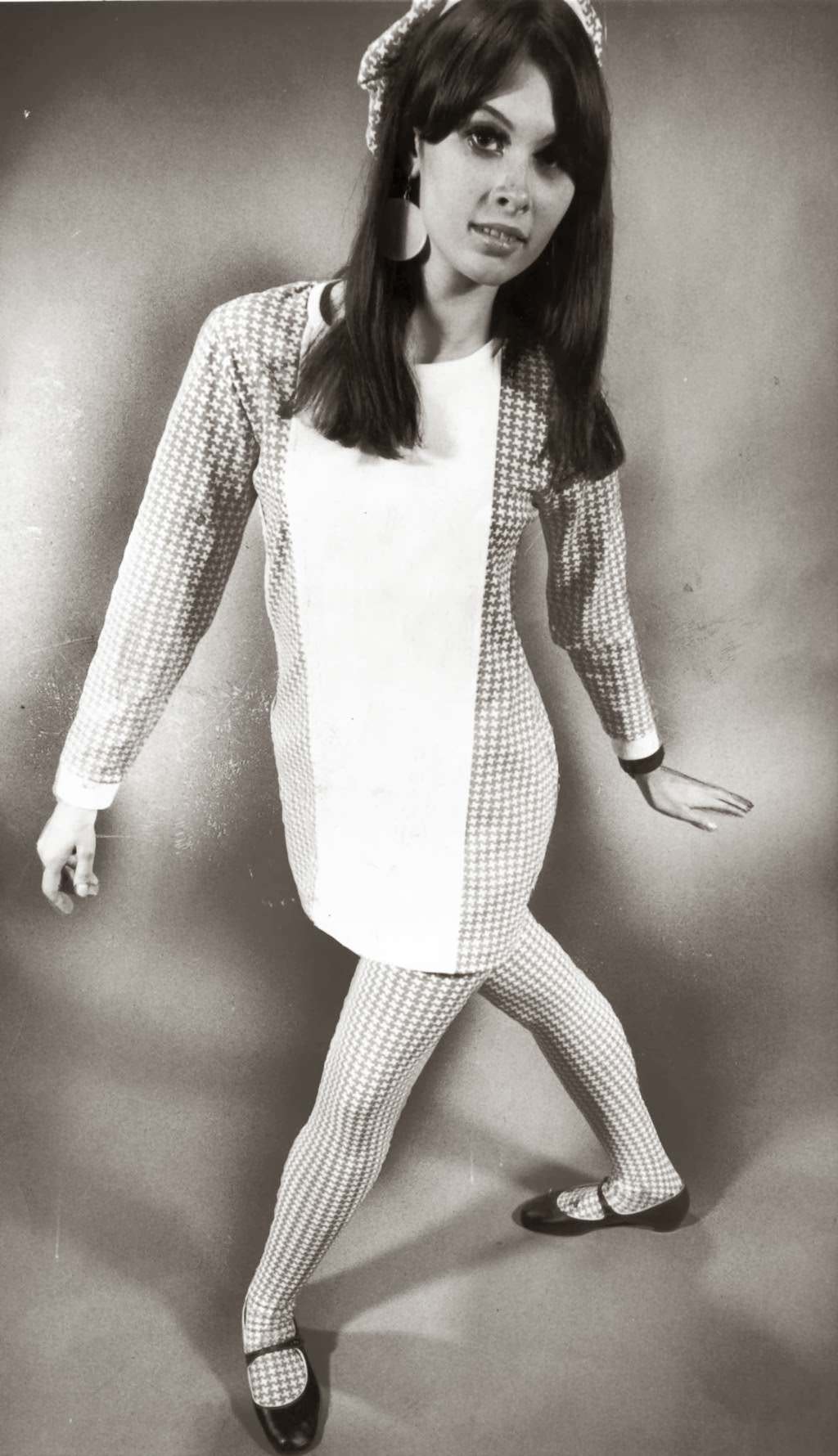 “Abstract houndstooth checks of stretch nylon are fashioned into tights with fencer-front tunic top plus cap ($20) at Cheetah boutique.” — Ron Bailey, Chicago Tribune, Oct. 10, 1966