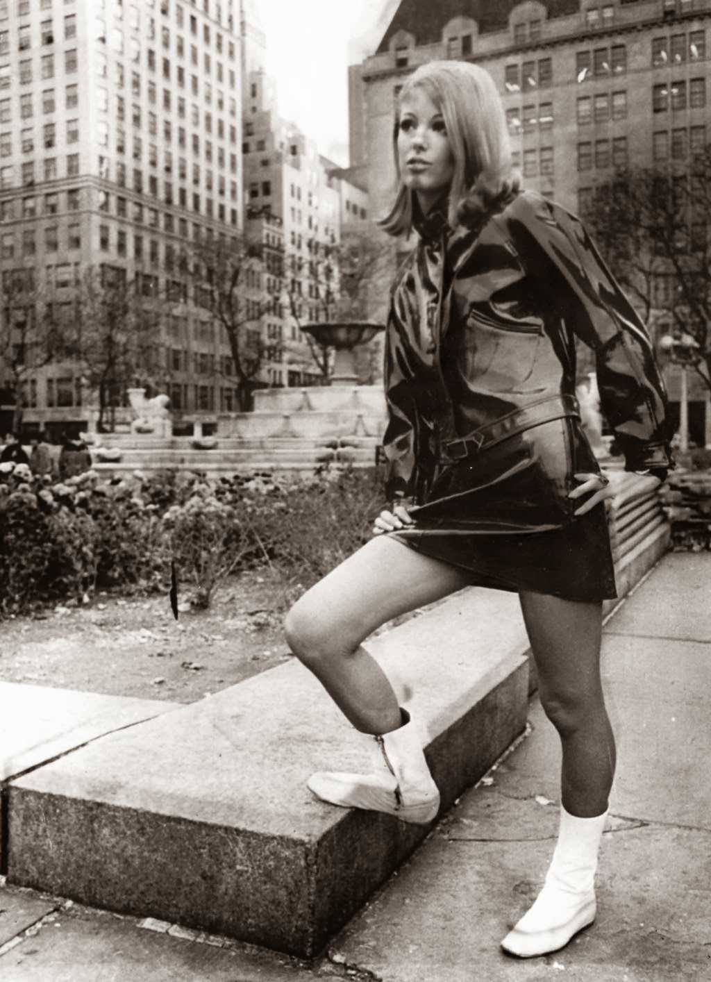 “Dressed in British designer Paul Blanche’s “Raingear,” a flared hipster miniskirt and Ike jacket, model Lorna McDonaugh brightens the scene at the plaza at 59th St. Such outfits could make rainy days popular.” — UPI Telephoto, Nov. 9, 1966