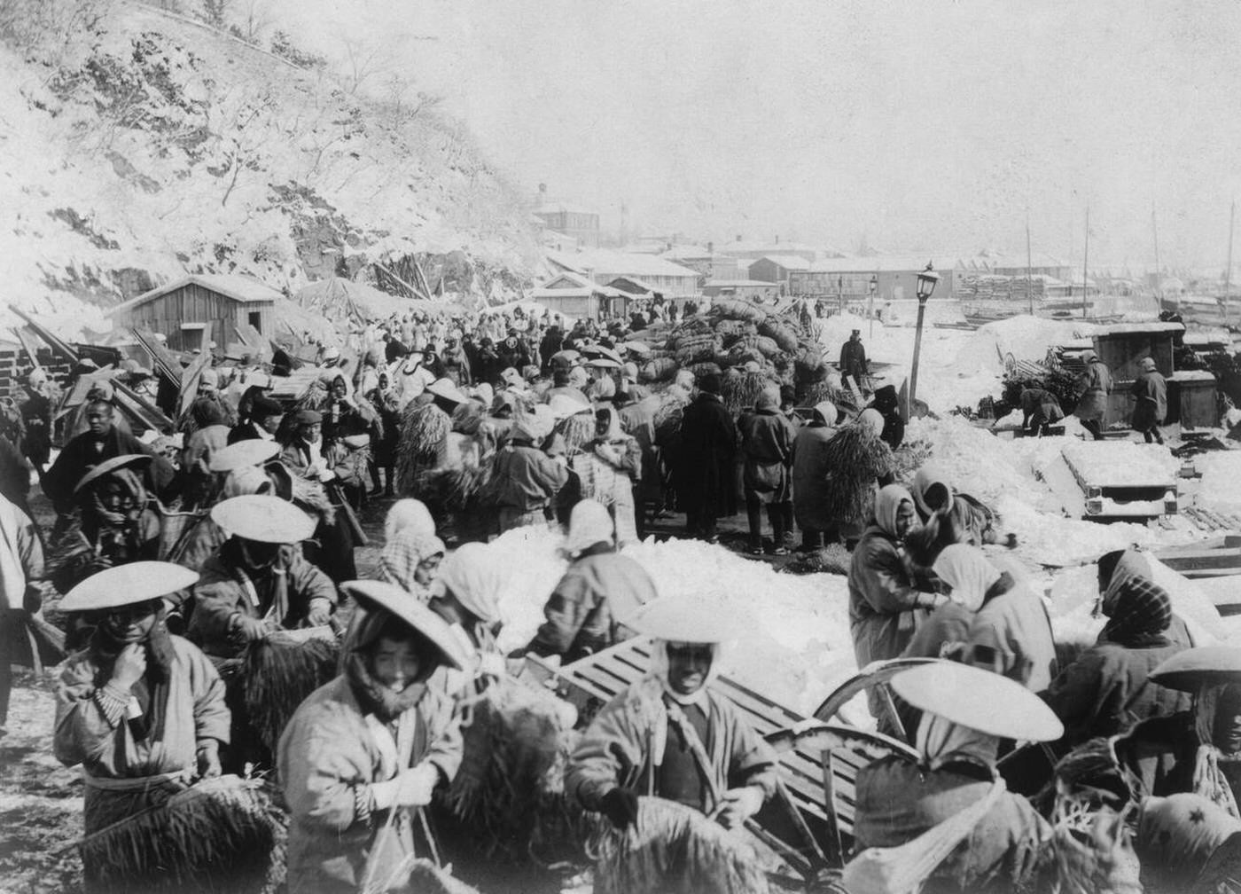 #50 Japanese and Korean coolies removing supplies from wharf of Chemulpo, Korea during the Russo Japanese War, 1904.