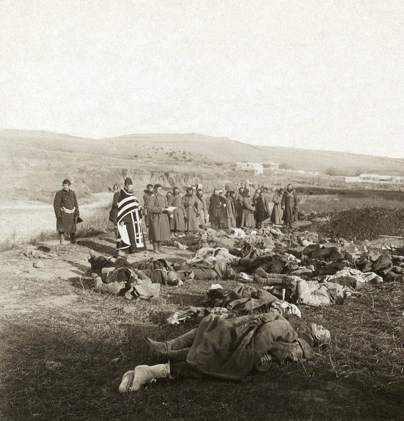 #57 Russian soldiers praying over their dead comrades brought back from the front, Port Arthur, China, 1905.