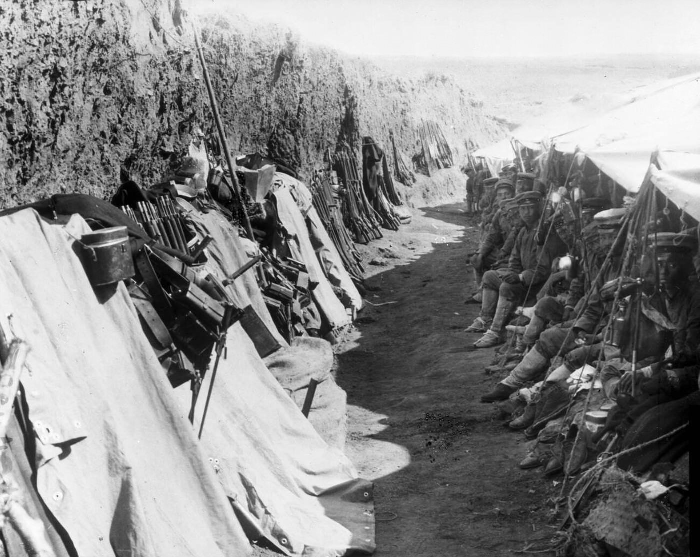 #67 Japanese soldiers resting in a trench during the Russo-Japanese War, Port Arthur, China, 1905.