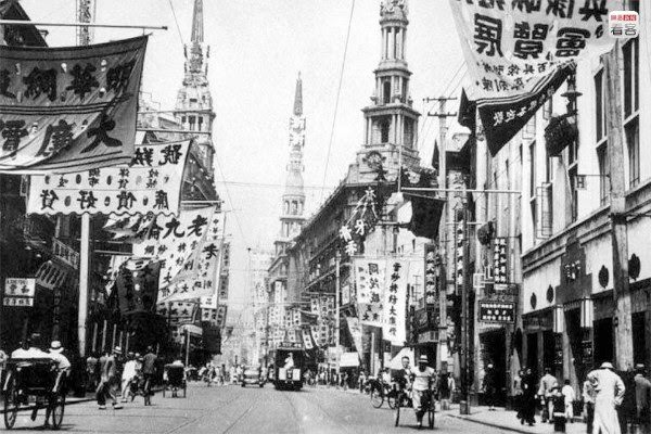 #12 Photo is of Nanjing Road in the ’30s of the 20th century, both sides of the street covered with signs.
