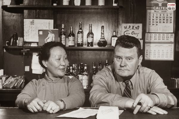 #24 1949 May 1, inside a bar, a photo of American bar owner Frank and his Chinese wife in their bar. This was several days before Communist Party forces reached Shanghai.