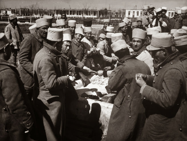 #14 South of Homs, men of the Tunisian infantry prepare to eat.