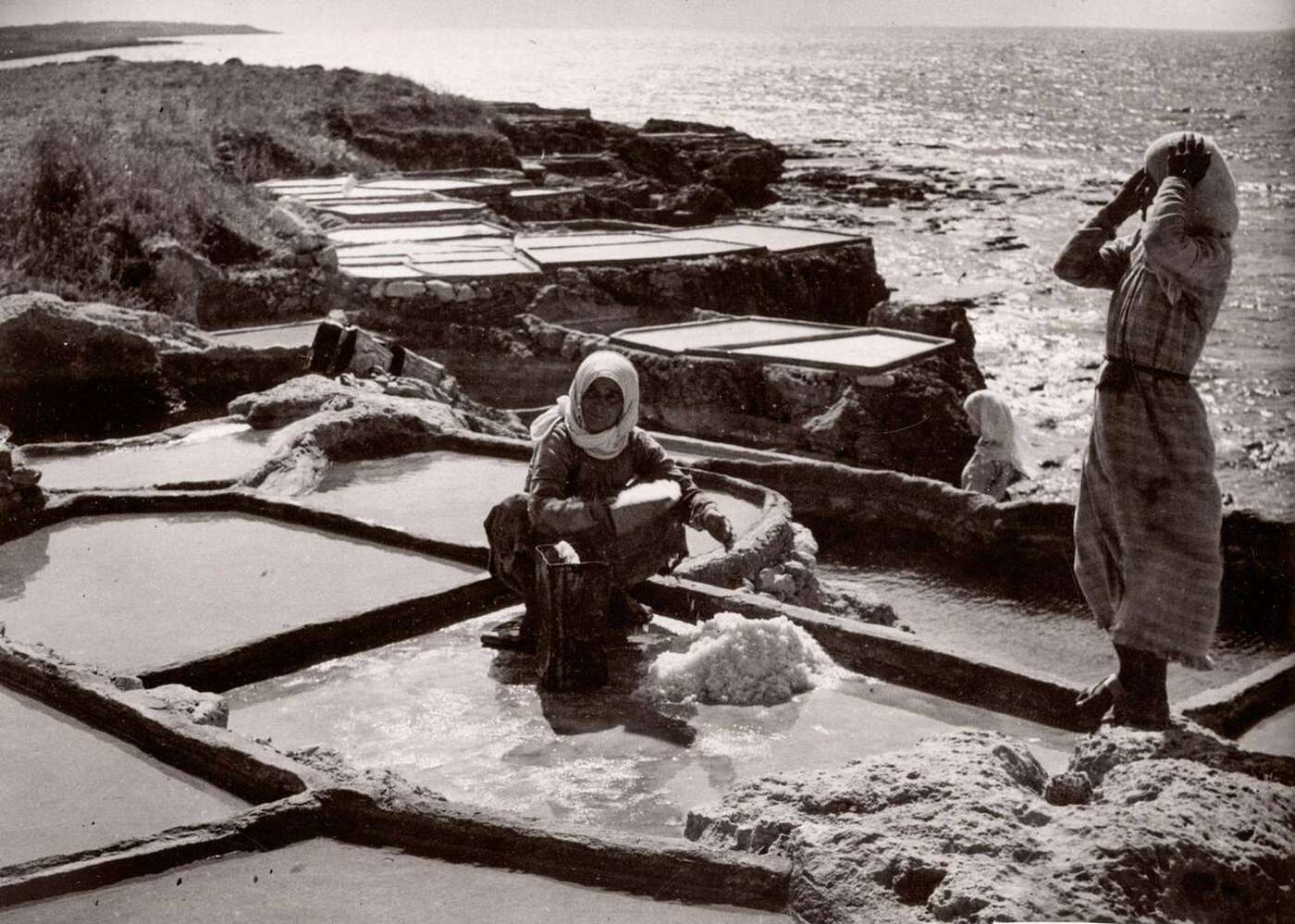 #70 Making salt from sea water by evaporation on the coast at Tartus, Syria, 1943.