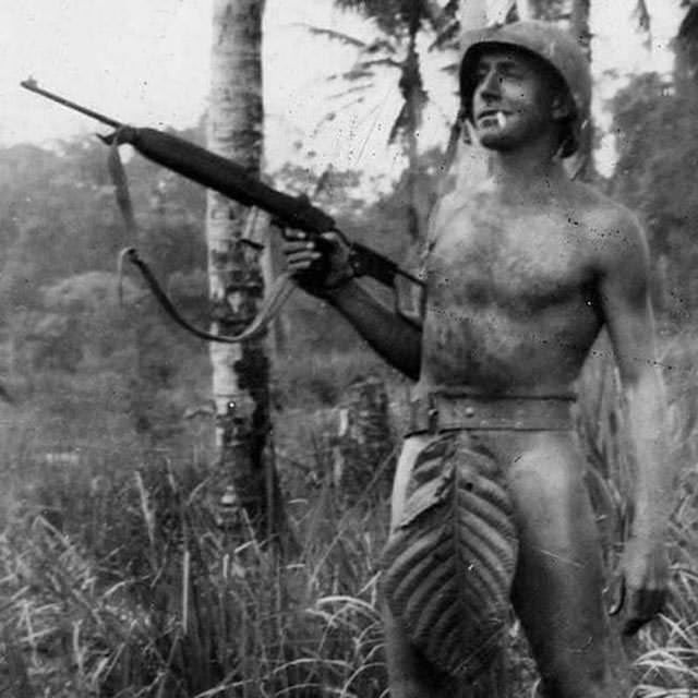 US Marine, Pacific Islands, poses for the camera, c. 1941 – 1945.