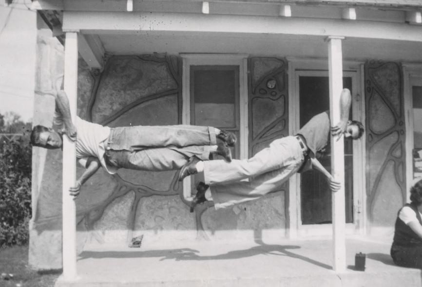 Two men demonstrating upper body strength.