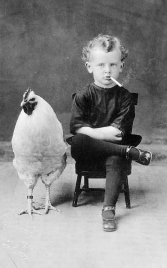 Portrait of Henri Groulx and his rooster, Paris, France, ca. 1920.