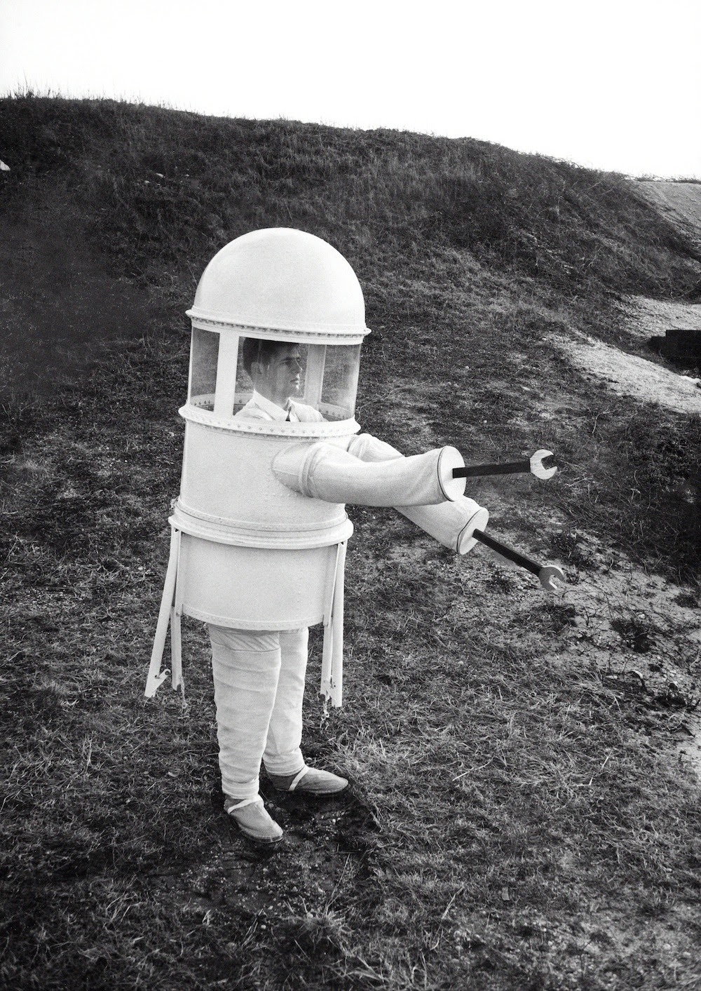 March 16, 1960. This suit built by the Republic Aviation Corporation solved the problem of what “the well-dressed man” would “wear for a stroll over the airless moonscape.” An article in the New York Times promised that the outfit would have its own oxygen supply and that its tripod legs would “enable its wearer to rest by sitting on a perch inside.” The wrench hands were presumably for securing loose screws.