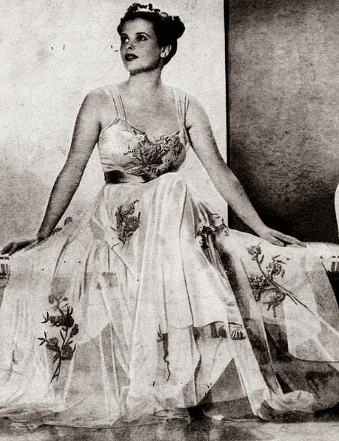 Actress Mary Maguire, wearing a beautiful evening gown in a promotional photograph, ca. 1936