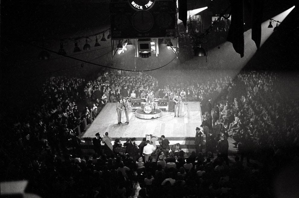 #15 The Beatles perform at the Coliseum in Washington, D.C., during their first American tour, 1964.