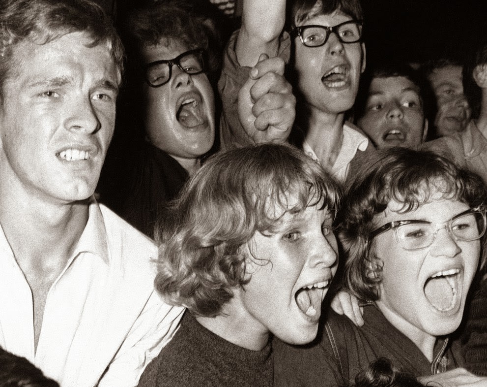 Dutch fans scream and shout during a performance by the Beatles in Blokker, Netherlands, 1964.