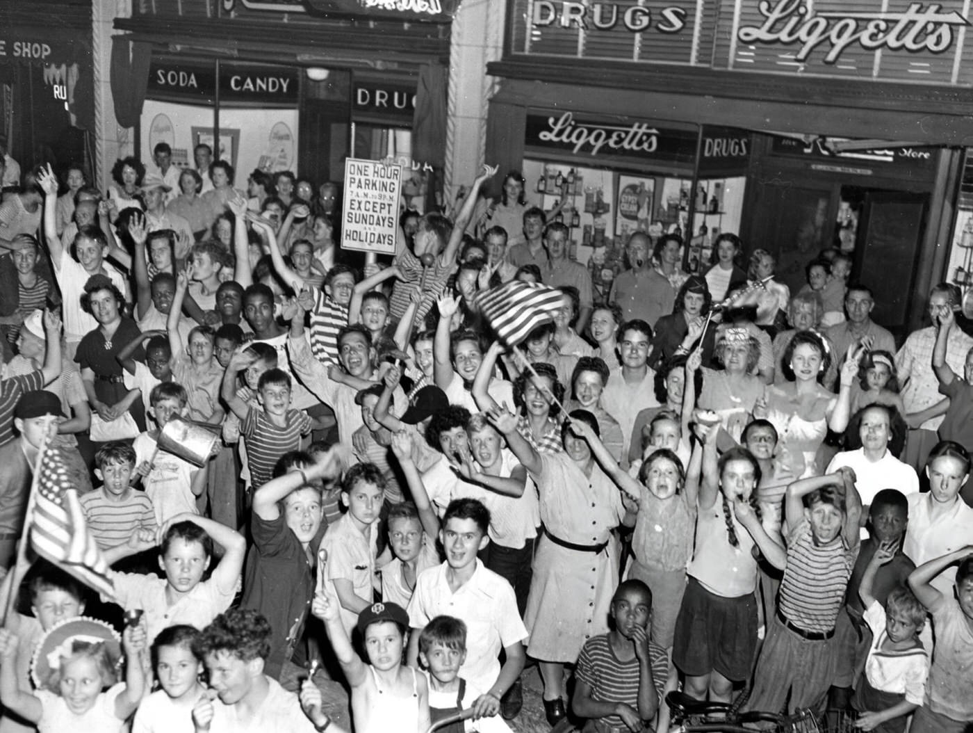 #15 Crowds celebrate the end of World War II in West Newton Square on Washington Street, Boston, 1945.