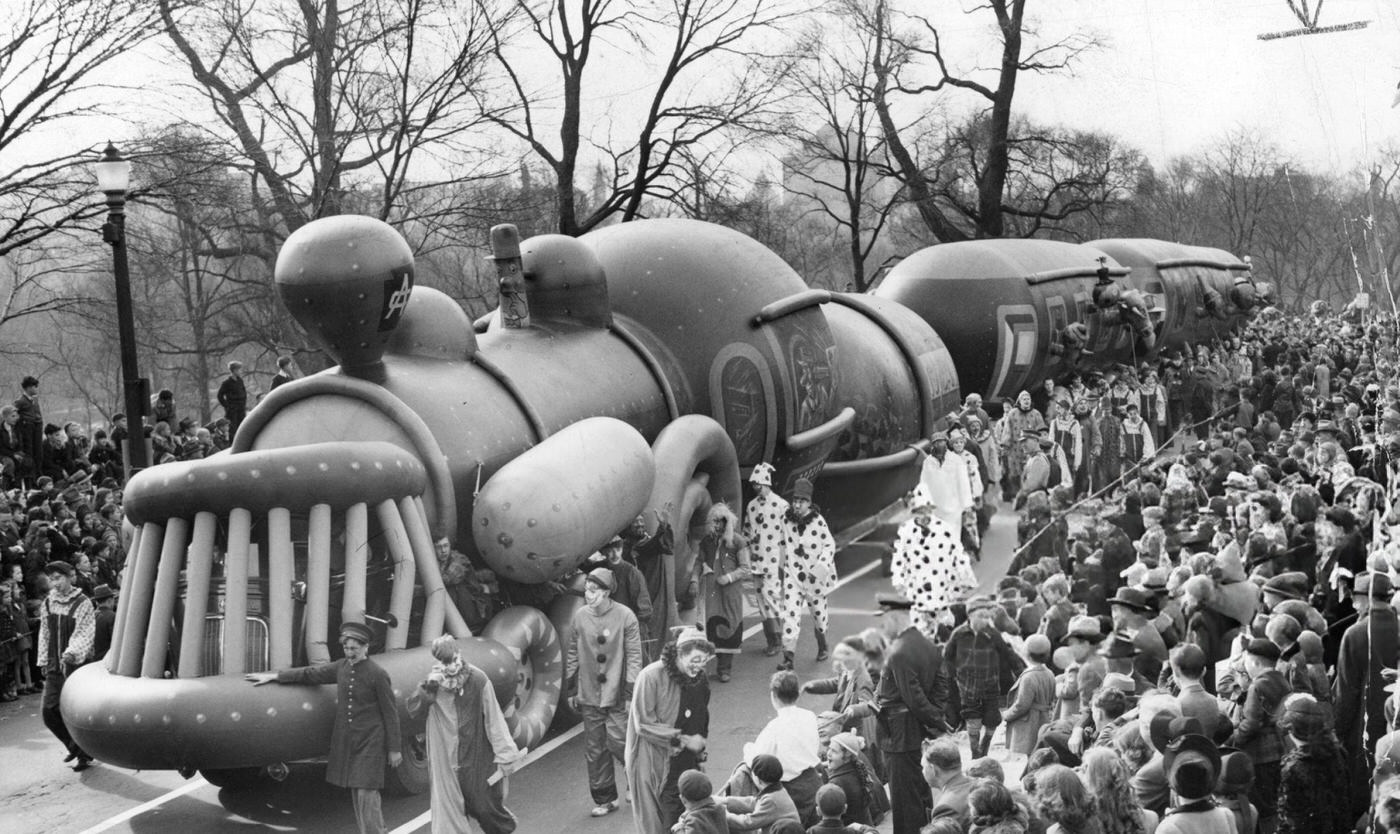 #20 The train balloon is led along Beacon Street during the annual Santason parade in Boston, 1941.