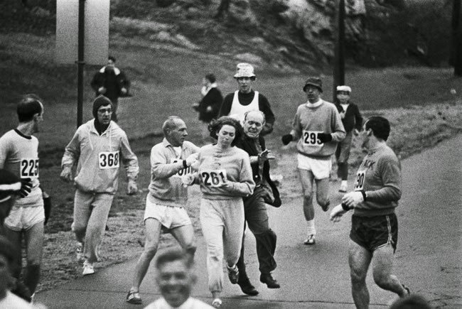 #14 Kathrine Switzer becomes the first woman to run the Boston Marathon, despite attempts by the marathon organizer to stop her, 1967.