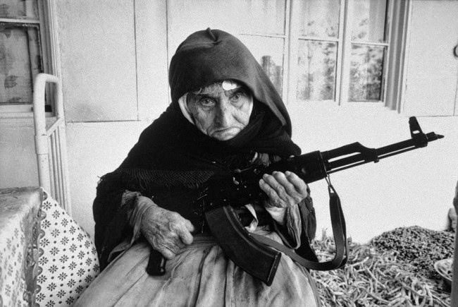 #18 An 106-year old Armenian woman protecting her home with an AK-47, 1990.