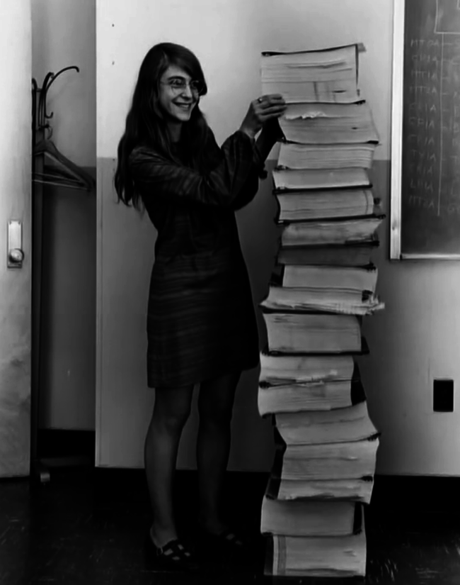 #2 Margaret Hamilton, lead software engineer of the Apollo Project, stands next to the code she wrote by hand and that was used to take humanity to the moon, 1969.