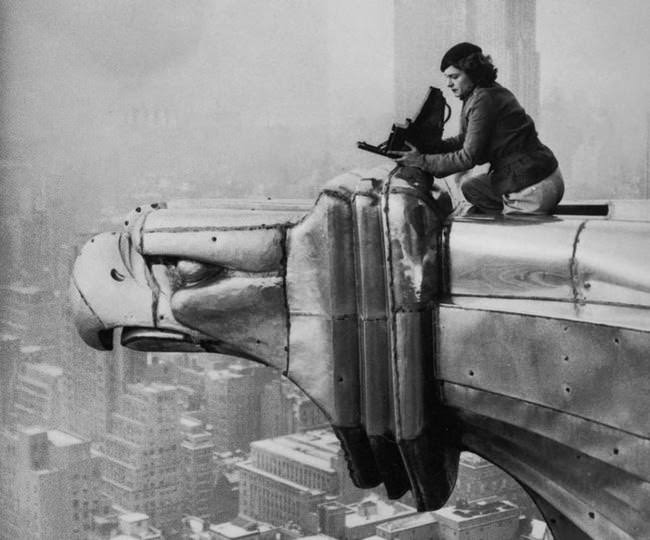 #21 Margaret Bourke-White, a photographer, climbing the Chrysler Building, 1934.