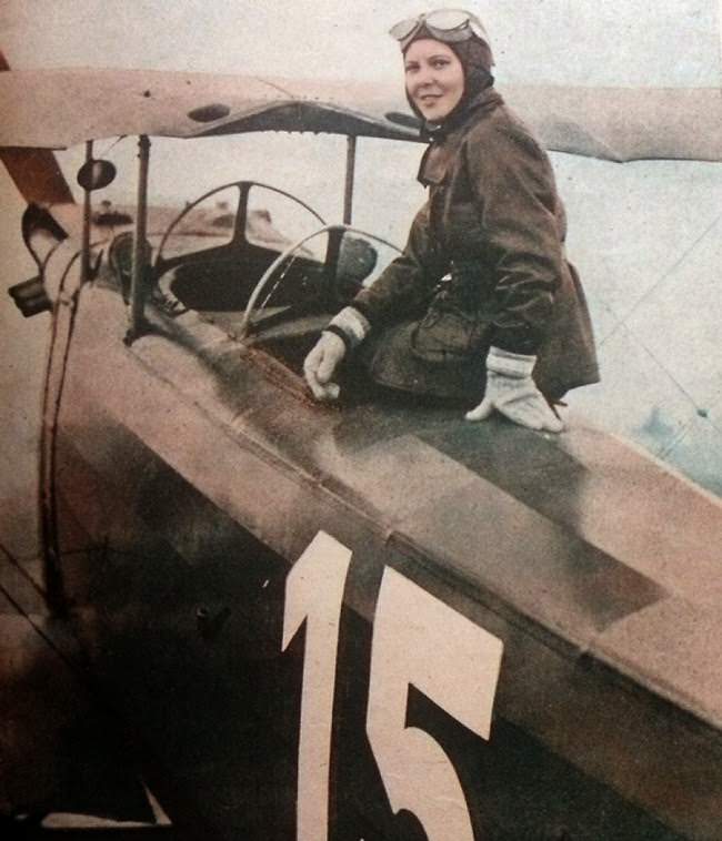 #24 Sabiha Gökçen of Turkey poses with her plane; in 1937 she became the first female fighter pilot.