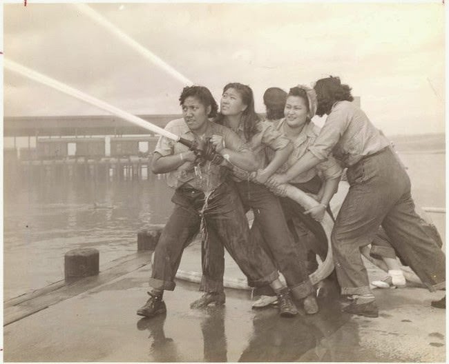 #25 Volunteers learn how to fight fires at Pearl Harbor, 1940s.