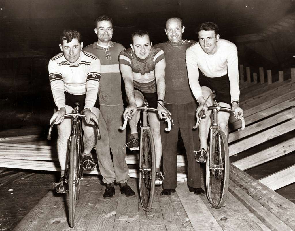 Cocky O’Brien, Charley Logan, Val Melchiori, Tom Saetta, and Cesare Moretti eager to start Chicago’s first post-war six-day bike marathon of the year at the Coliseum in Chicago, 1946.