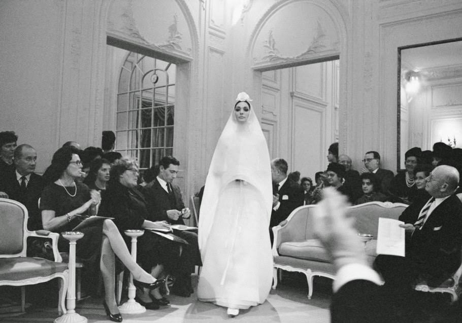 Kouka models a wedding dress in Dior’s Grand Salon, Spring-Summer 1961 haute-couture collection.